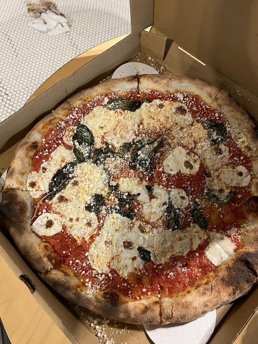 Margherita pizza with fresh mozzarella, basil, and San Marzano tomato sauce
