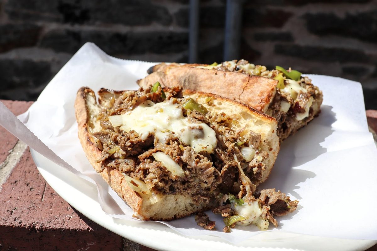 Philly Cheesesteak with dry-aged steak and melted cheese on house-made bread